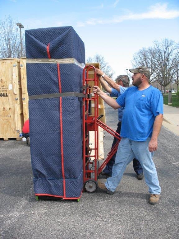 movers with large item on caddy